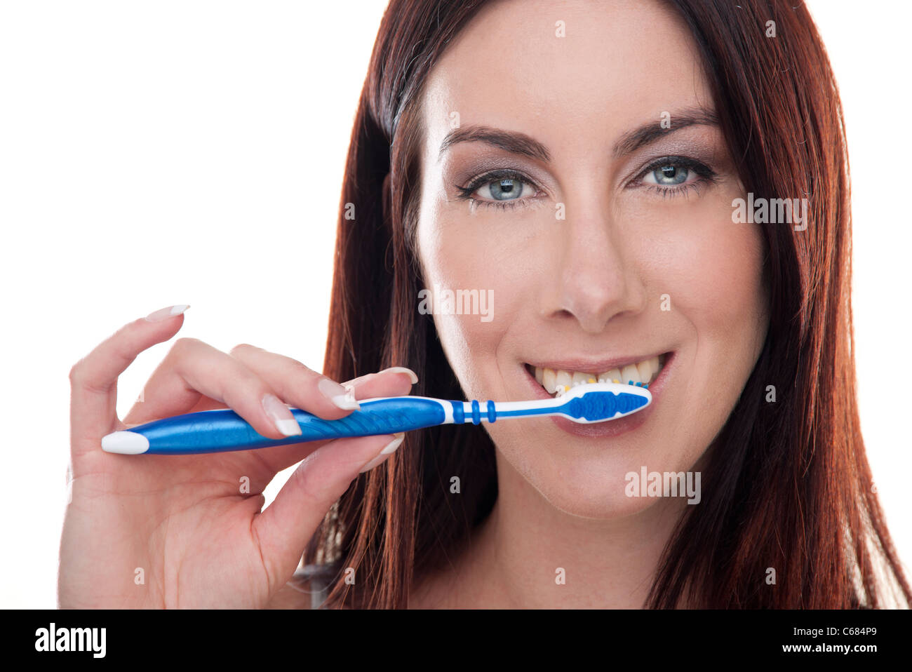 woman brushing her teeth , holding a toothbrush Stock Photo Alamy