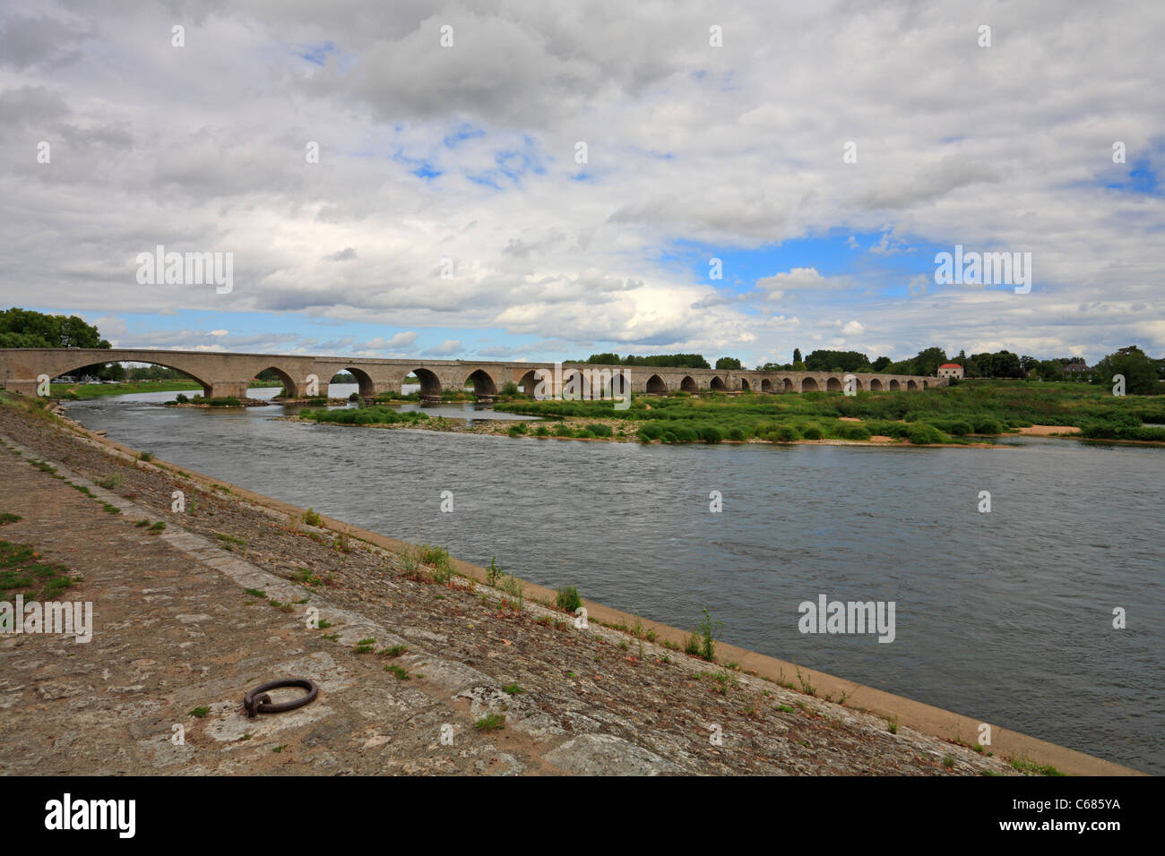 14th Century bridge over the Loire River leading to the medieval town of Beaugency in the Loire Valley, France. Stock Photo