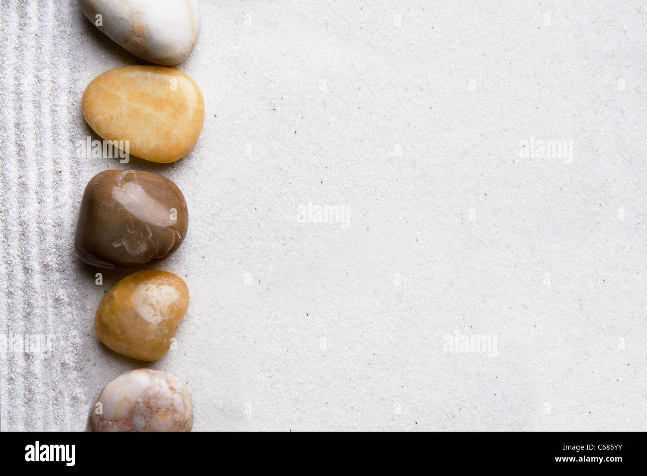 Rocks and sand on a beach style background Stock Photo - Alamy