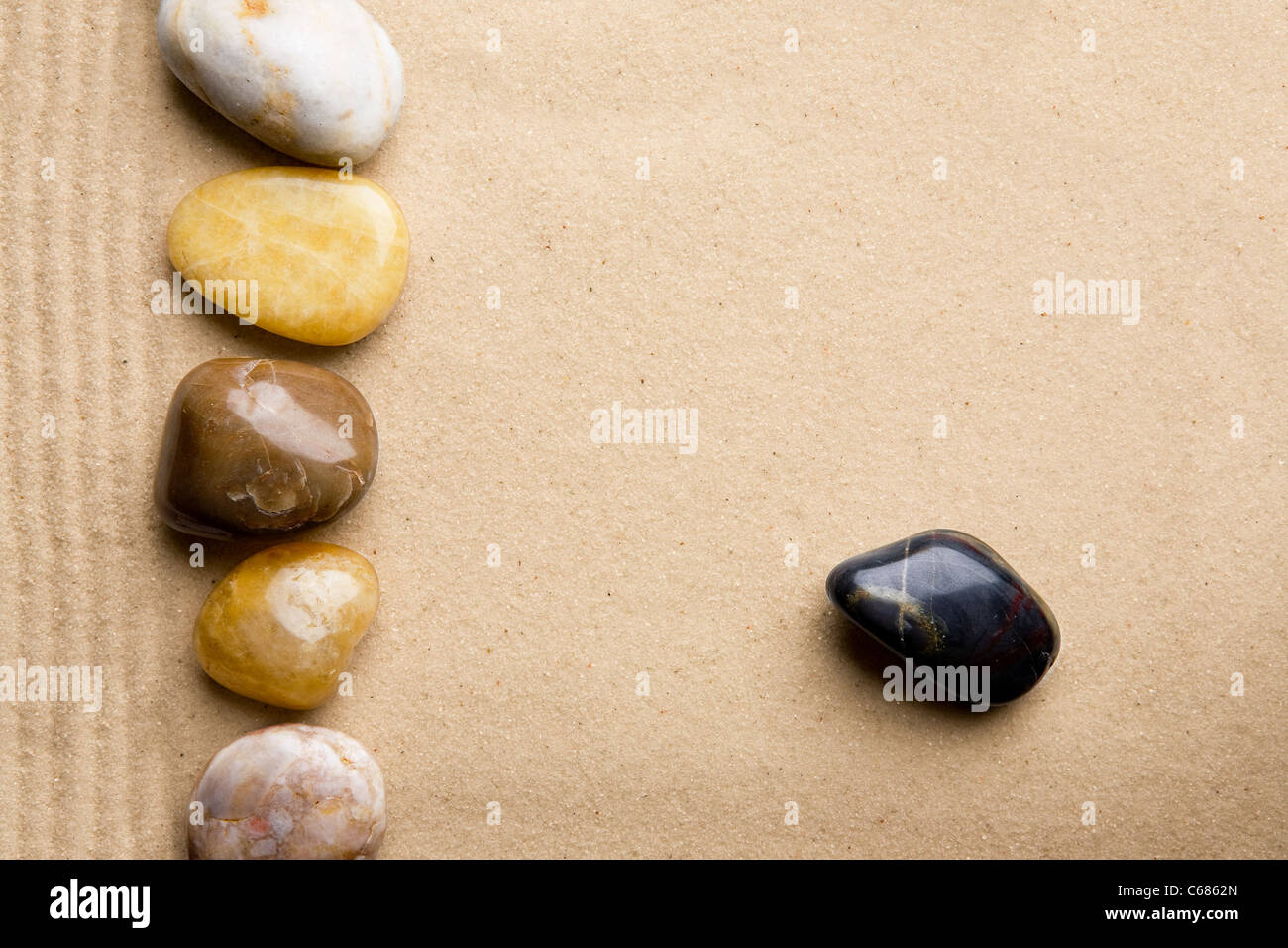 Rocks and sand on a beach style background Stock Photo - Alamy