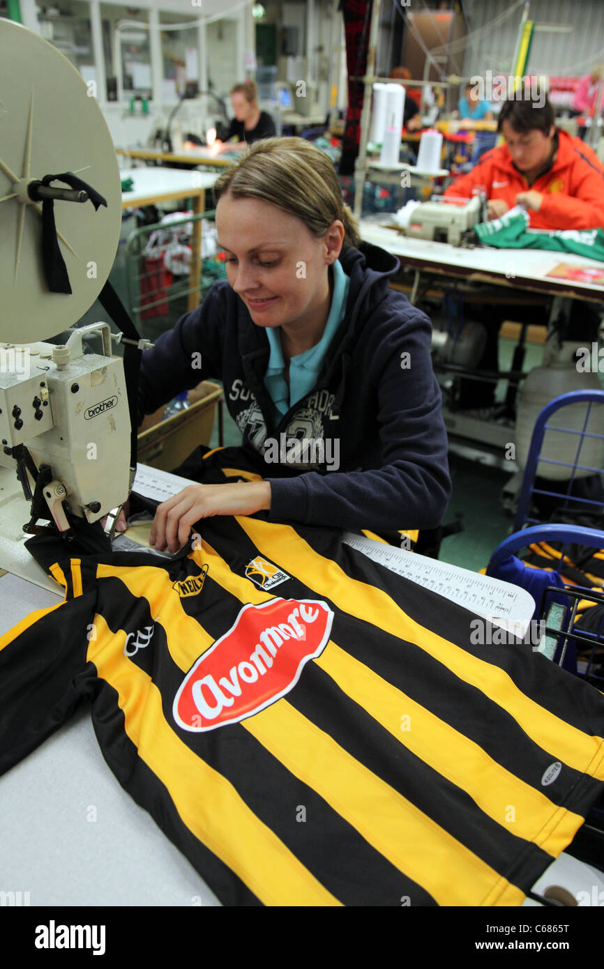 Stitching O'Neill's Kilkenny hurling shirt, Strabane Stock Photo