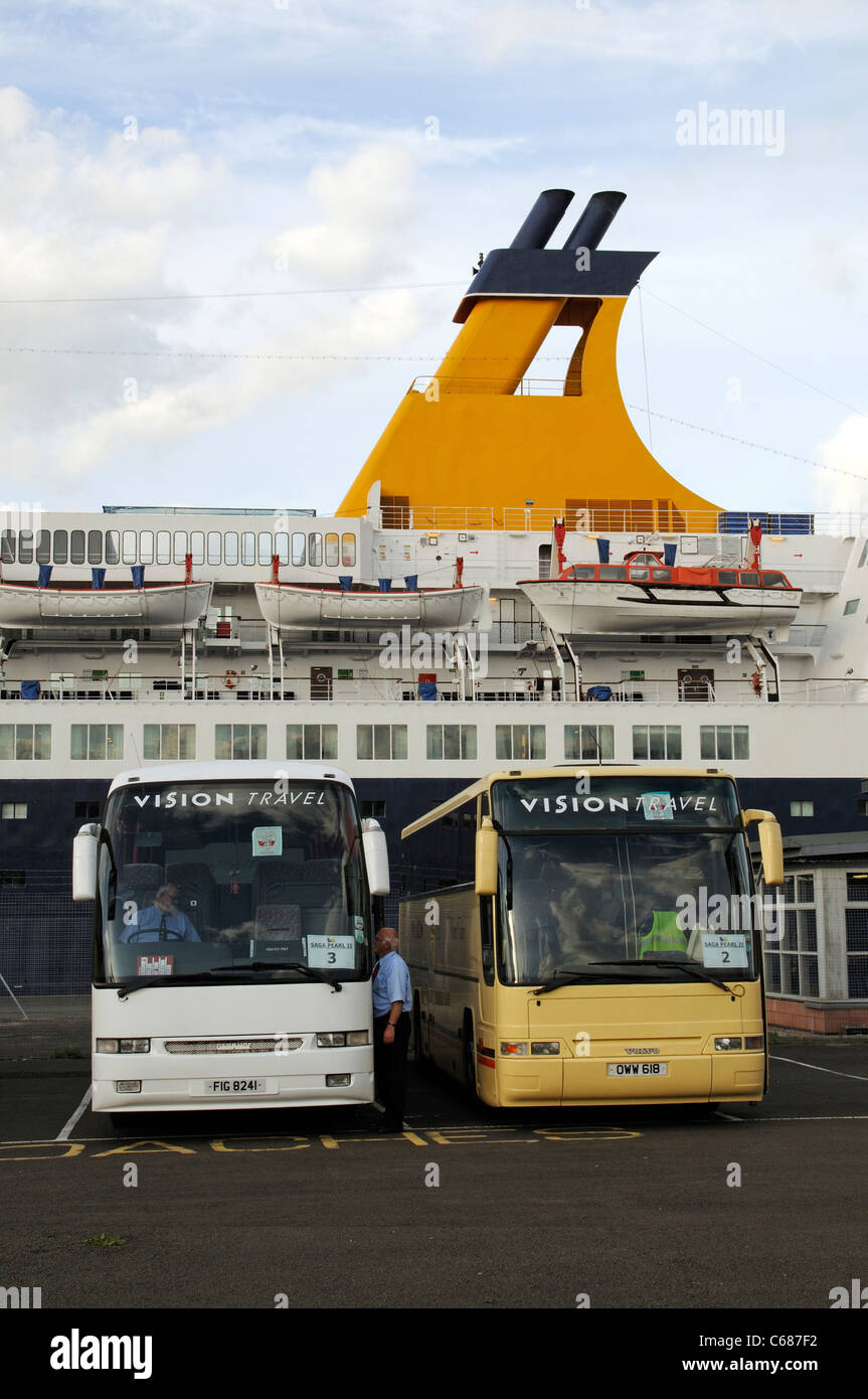 Saga Pearl 2 cruise ship berthed Ocean Terminal Leith near Edinburgh Scotland with tourist coaches waiting on the quay Stock Photo