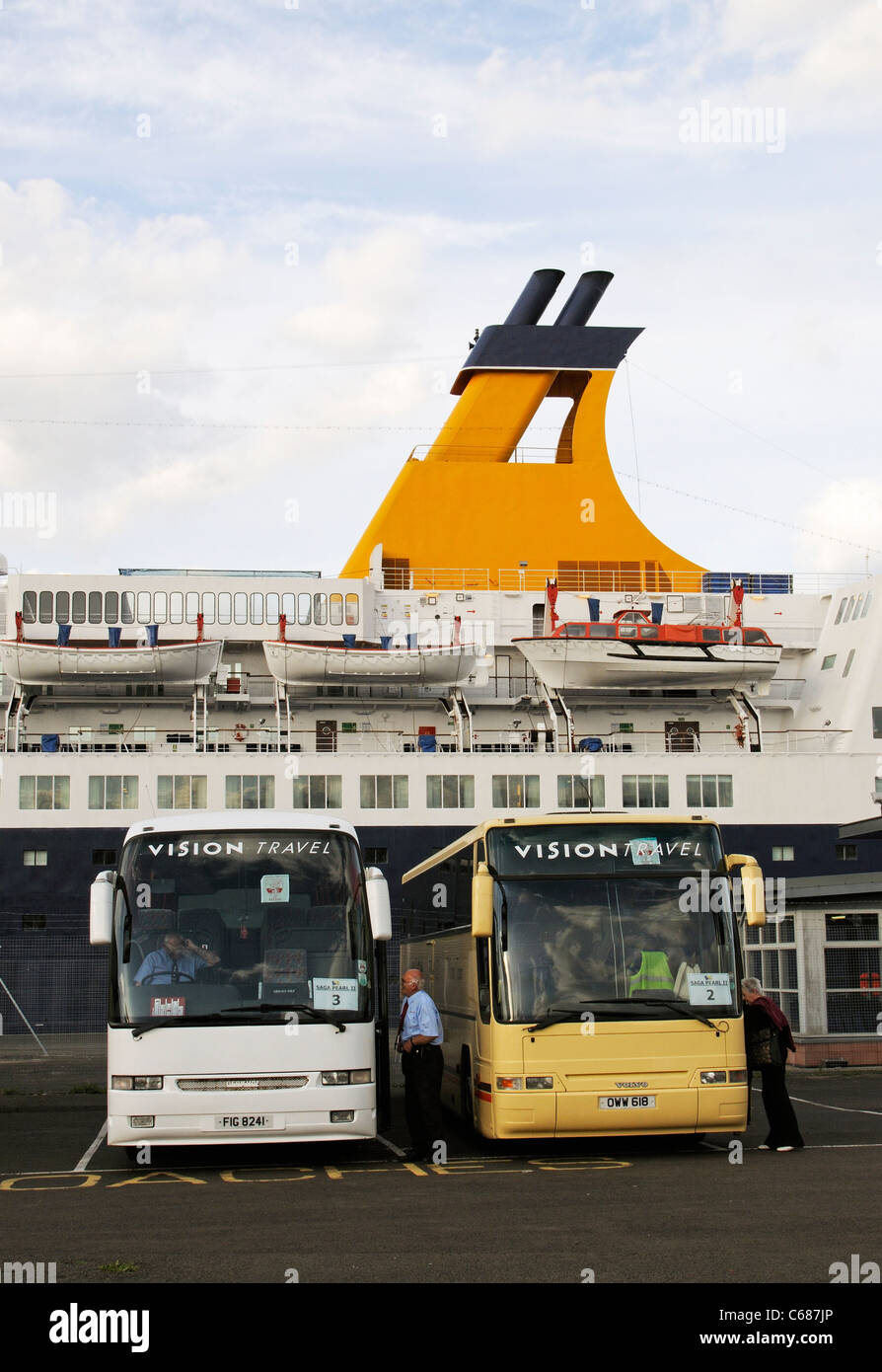 Saga Pearl 2 cruise ship berthed Ocean Terminal Leith near Edinburgh Scotland with tourist coaches waiting on the quay Stock Photo