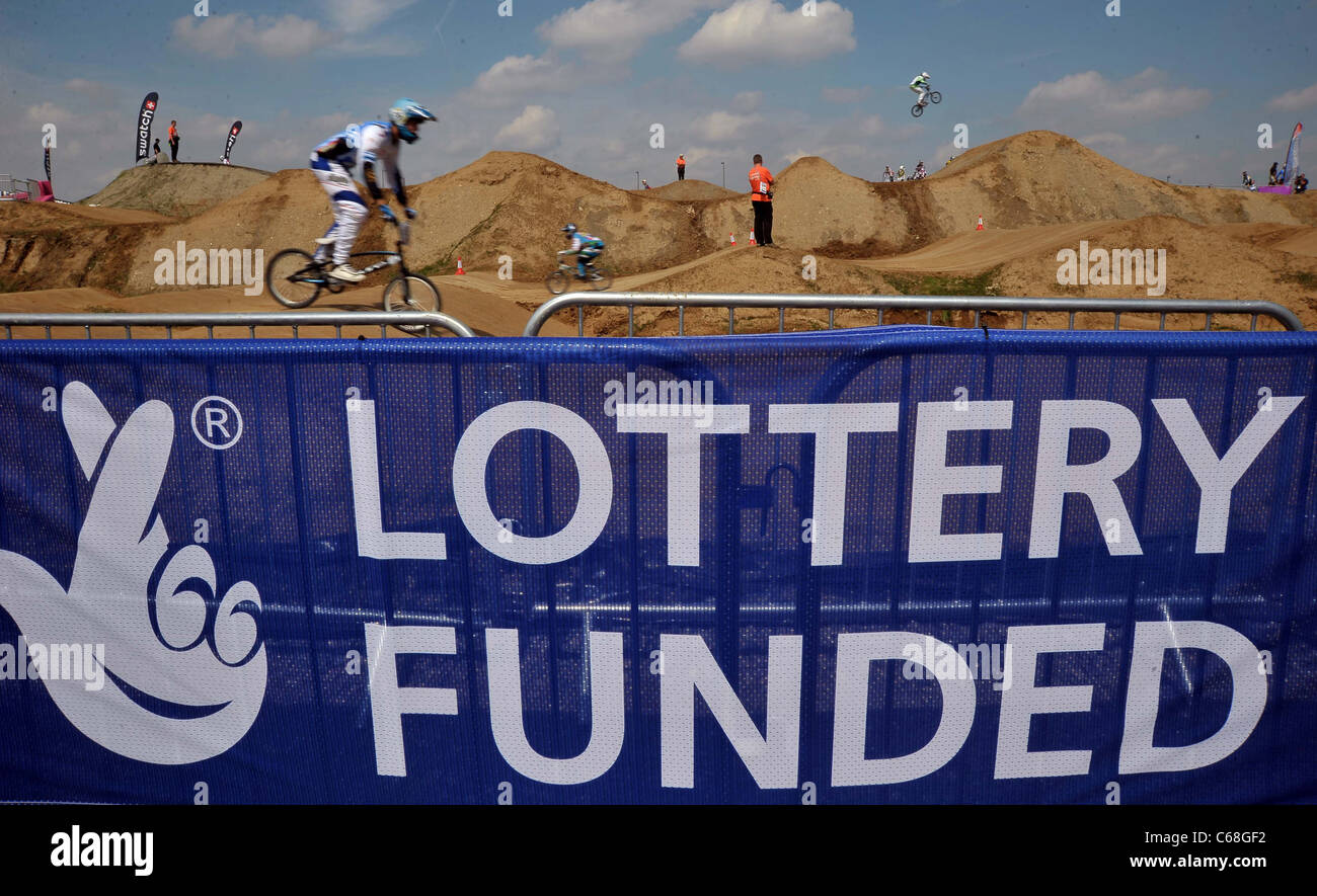 Lottery Funded logo with BMX riders in the background. UCI BMX Supercross World Cup. Part of the London Prepares Series. BMX Tra Stock Photo