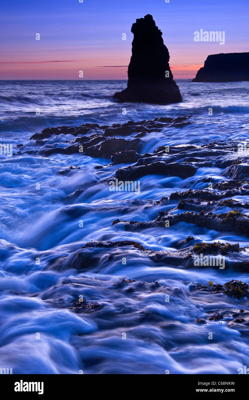 Dramatic view of a sea stack in Davenport Beach, Santa Cruz. Stock Photo