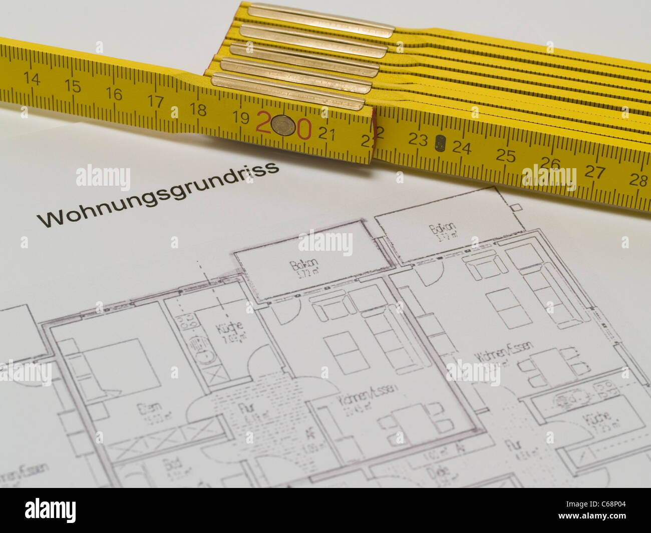 Wohnungsgrundriss und ein gelber Zollstock | ground plan and a yellow folding rule Stock Photo