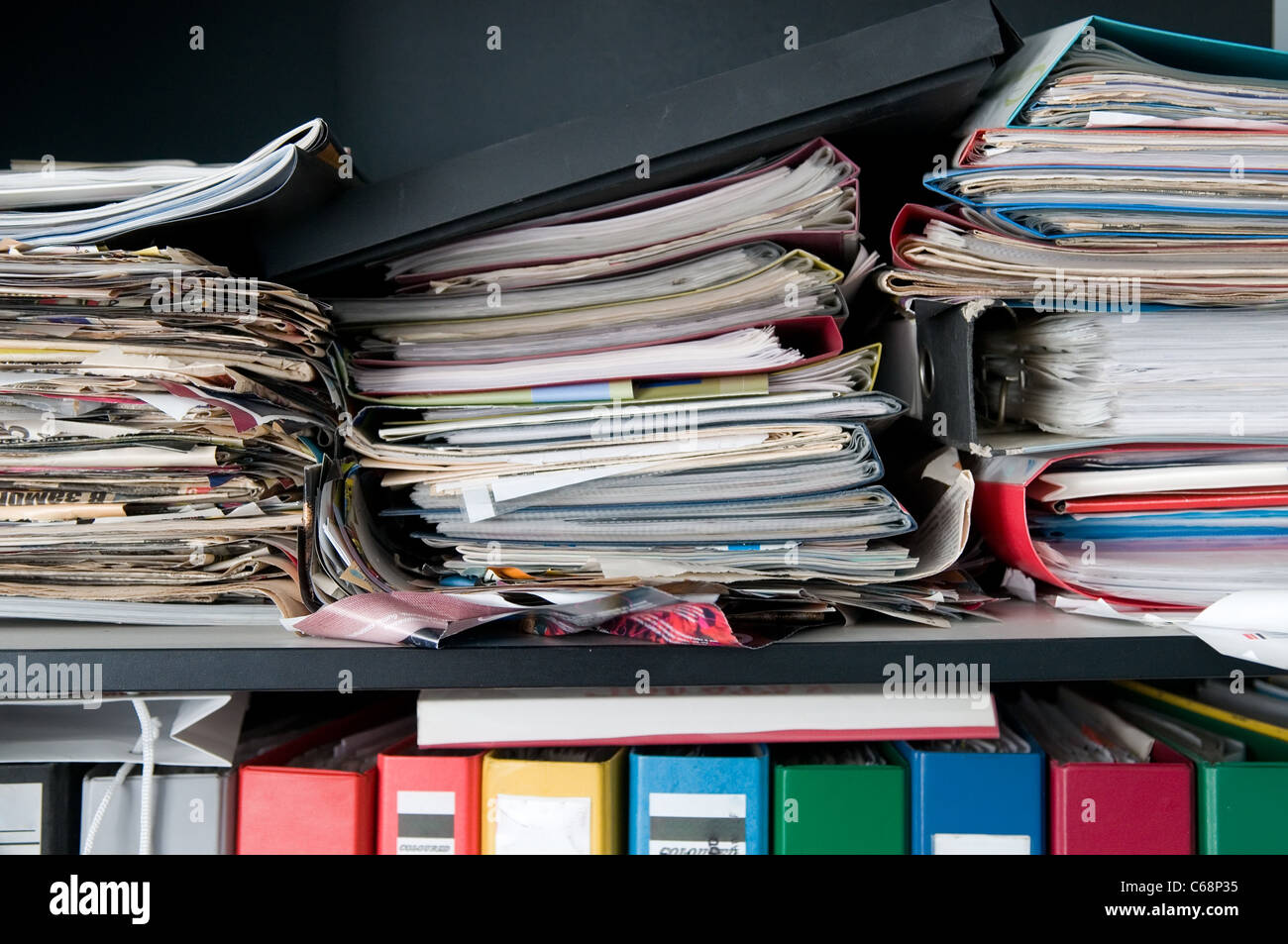 Messy case with a stack of documents Stock Photo - Alamy