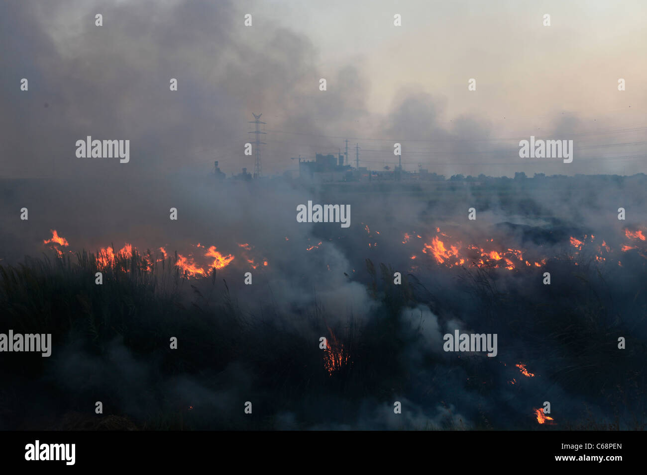 Smoke billows following a Grad rocket strike by Hammas on the coastal city of Ashdod in Israel from the Gaza Strip Stock Photo