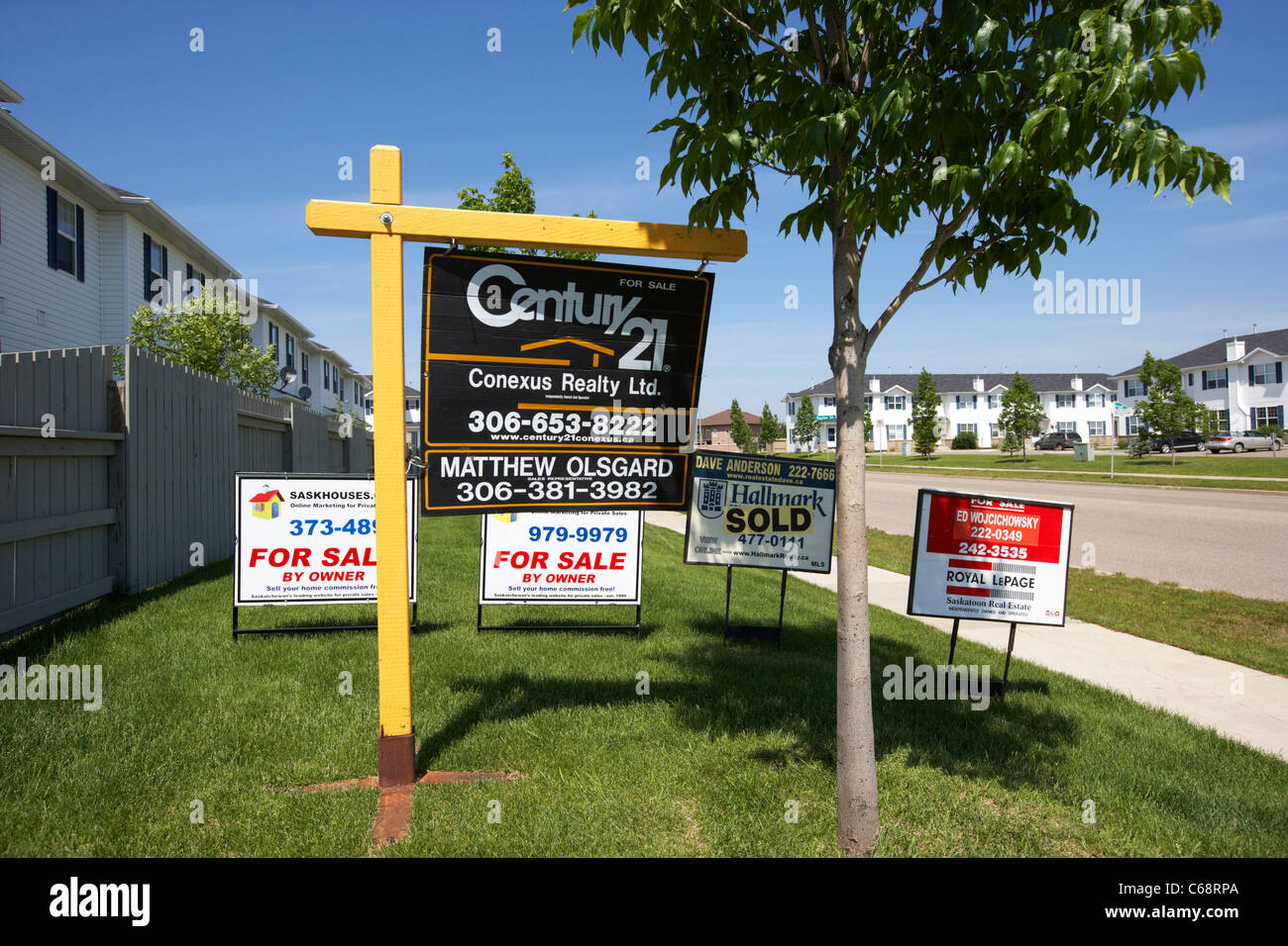 various for real estate agent signs in Saskatoon Saskatchewan Canada Stock Photo