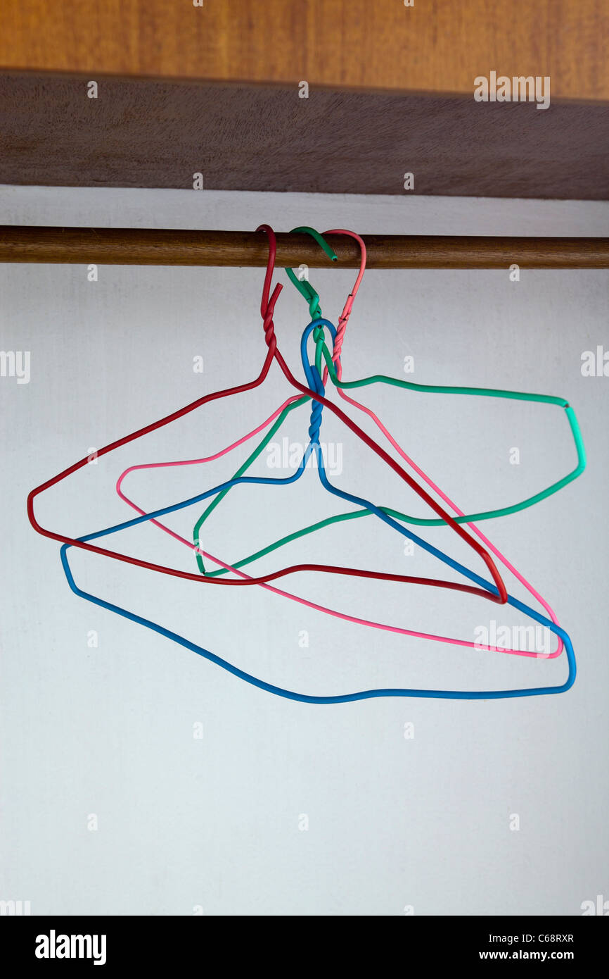 Wire Coat Hangers in Wardrobe Stock Photo Alamy