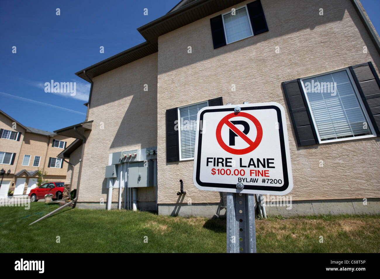 fire lane no parking fine bylaw sign in residential suburb area in Saskatoon Saskatchewan Canada Stock Photo