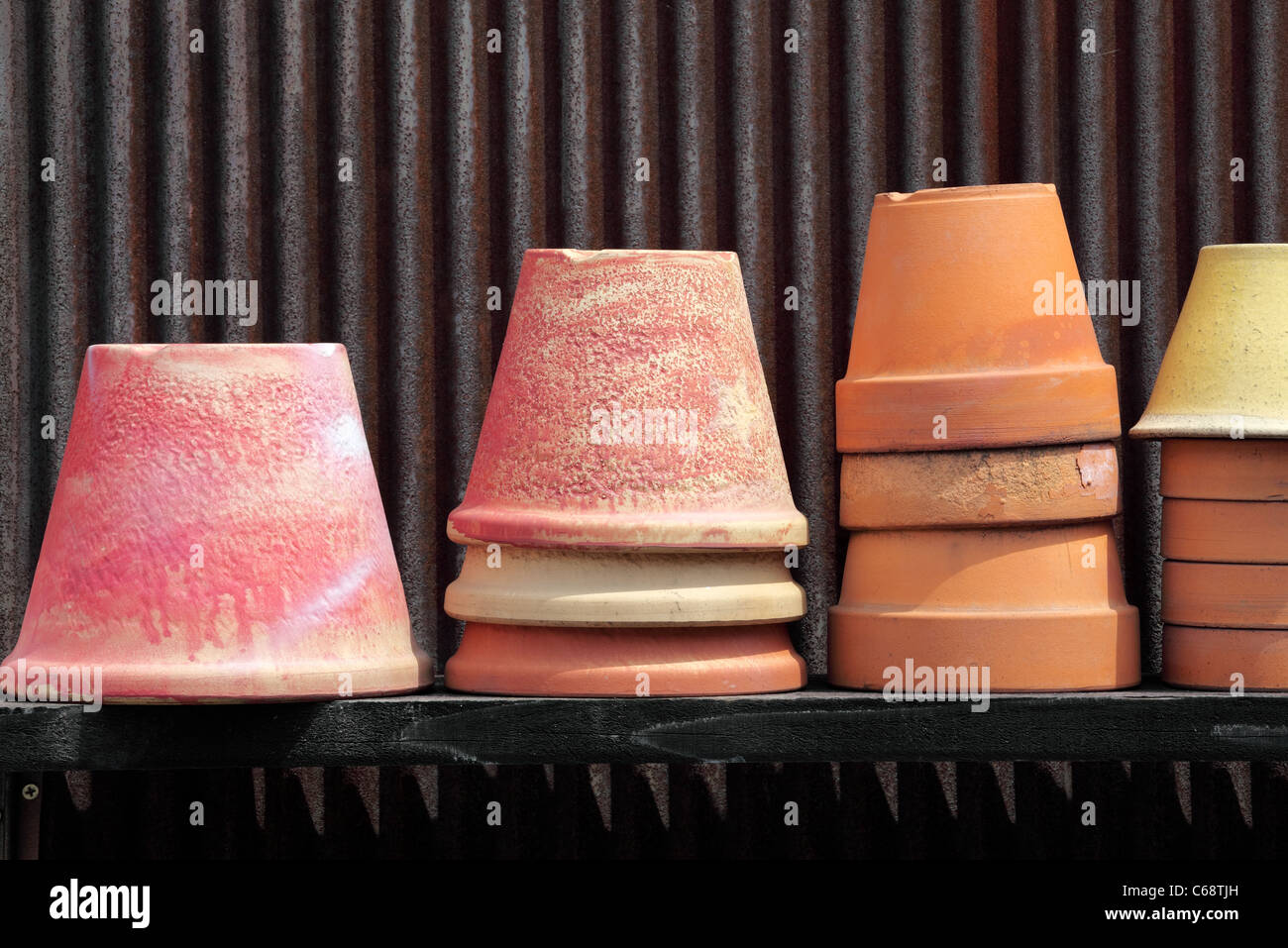 Plant pot put in front of warehouse Stock Photo Alamy