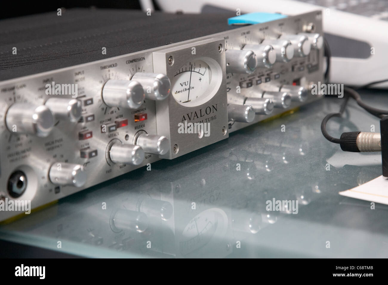 avalon vacuum tube discrete twin signal path opto compressor equalizer on a sound engineers desk Stock Photo