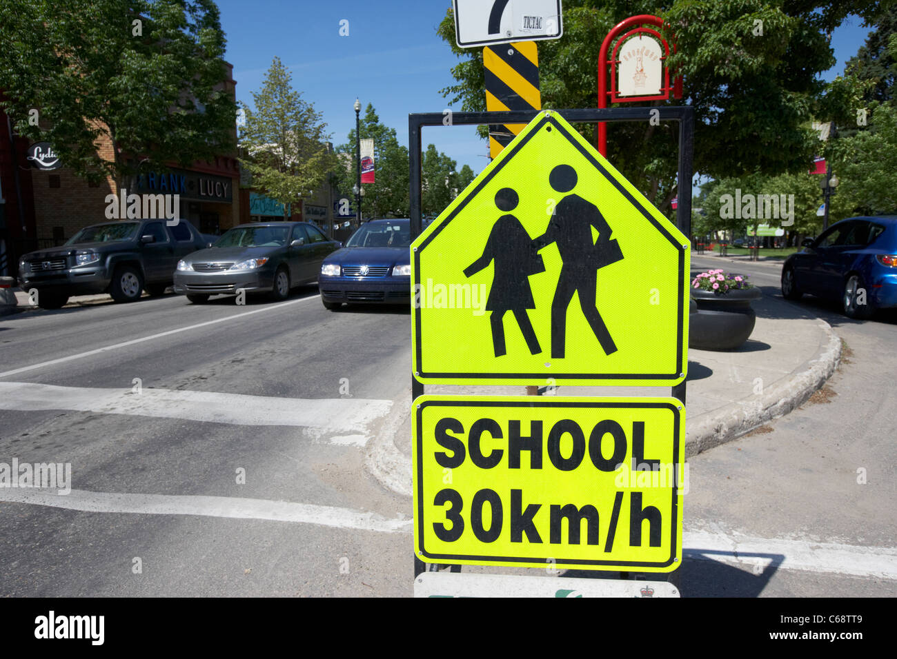 luminous temporary school crossing warning sign 30km/h Saskatoon Saskatchewan Canada Stock Photo