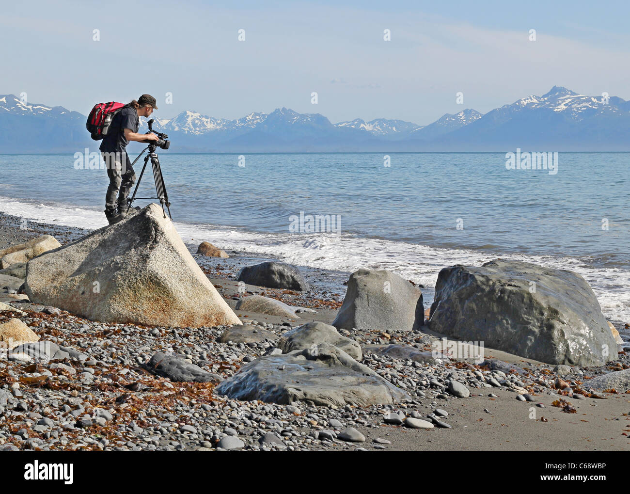 Shooting Rocks Beach Videographer shooting video hi-res stock photography and images - Alamy