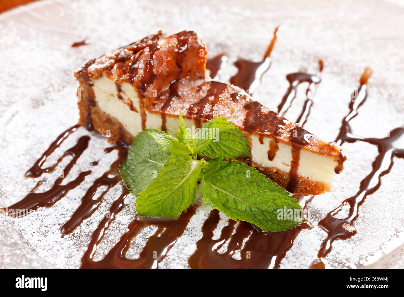 Cheesecake with Chocolate Sauce Stock Photo Alamy
