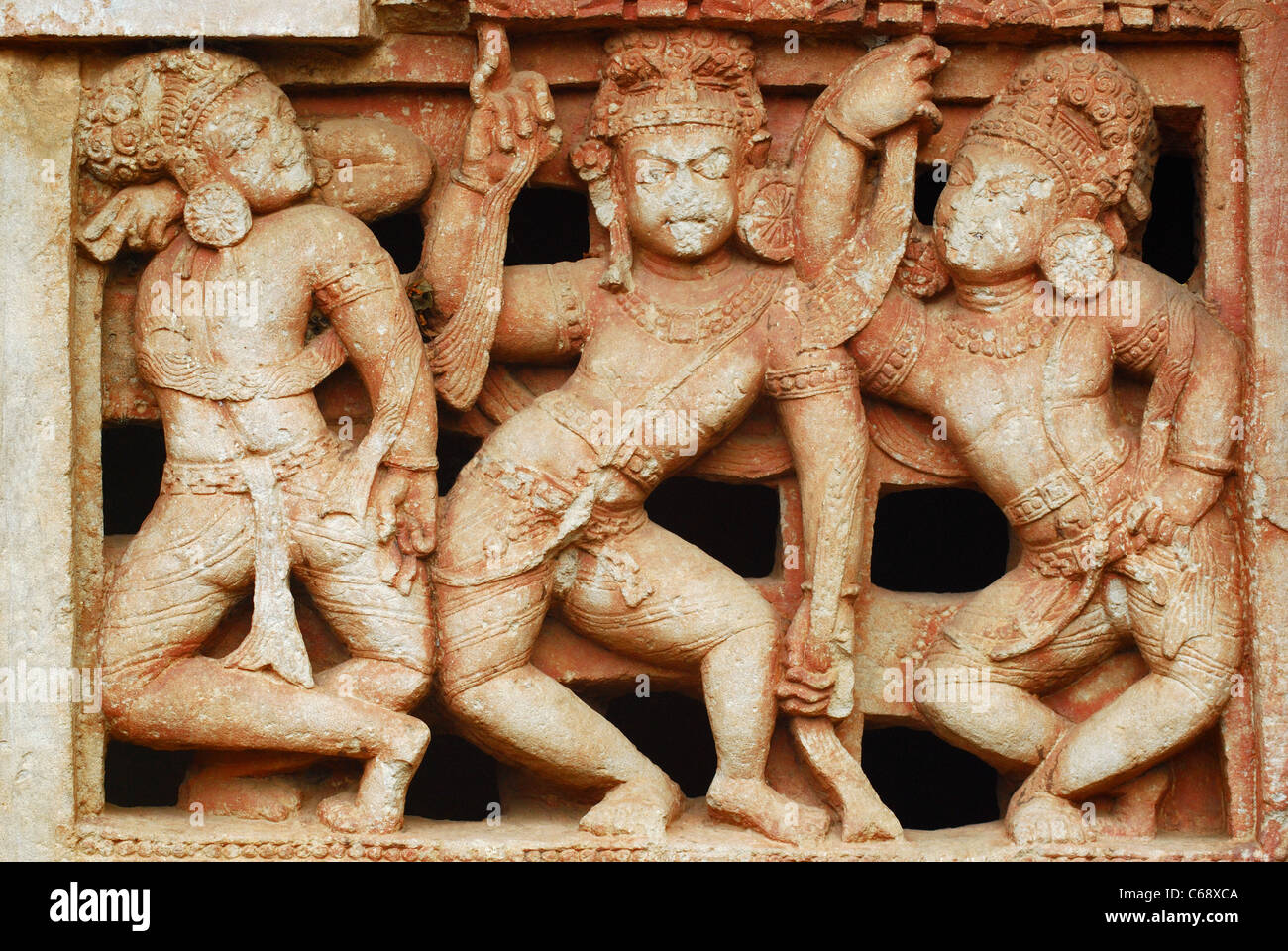 A sculpture on the window of 7th century Shiva Temple Stock Photo