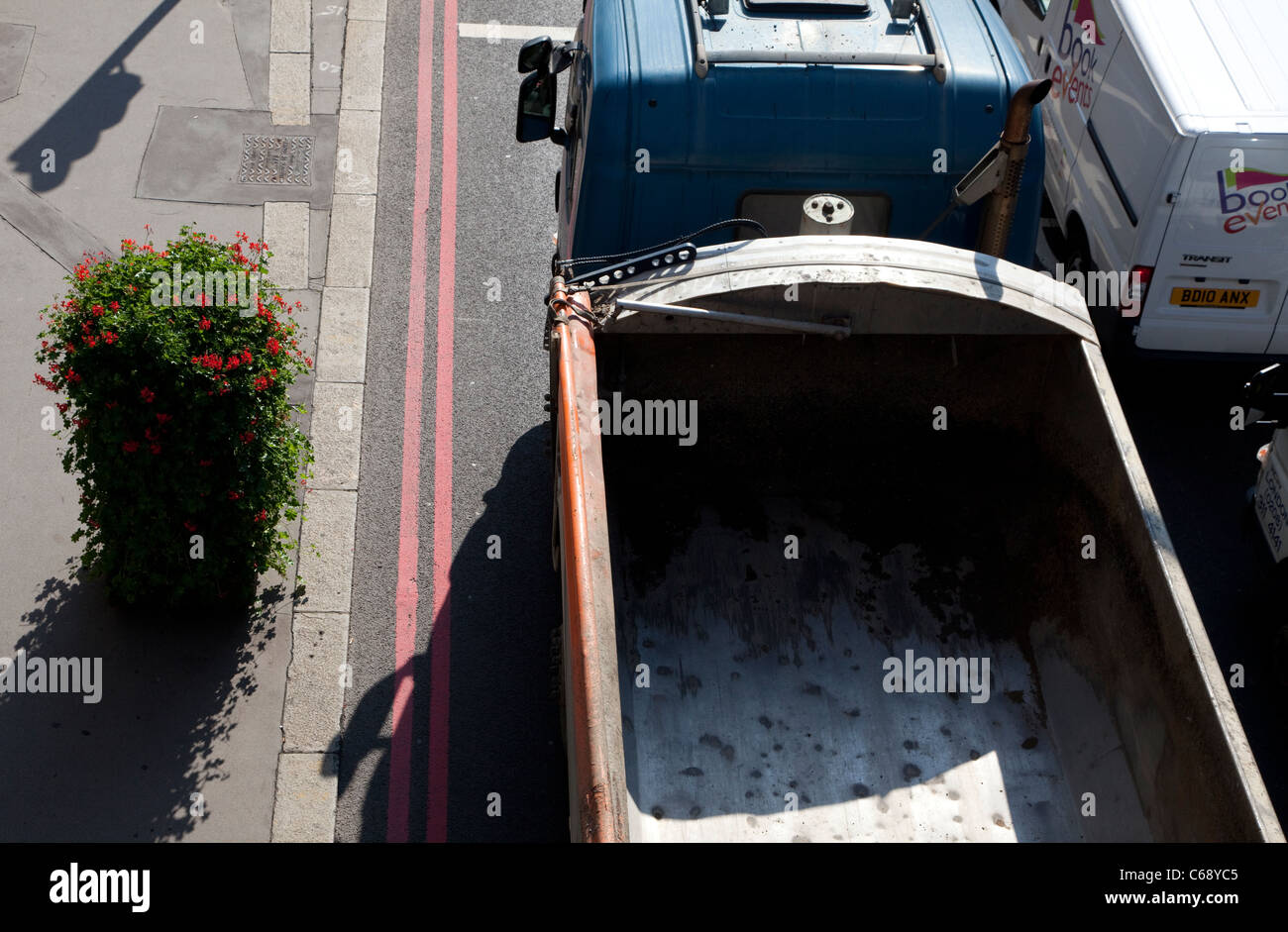 Plants placed in City of London street to absorb pollution from heavy traffic Stock Photo