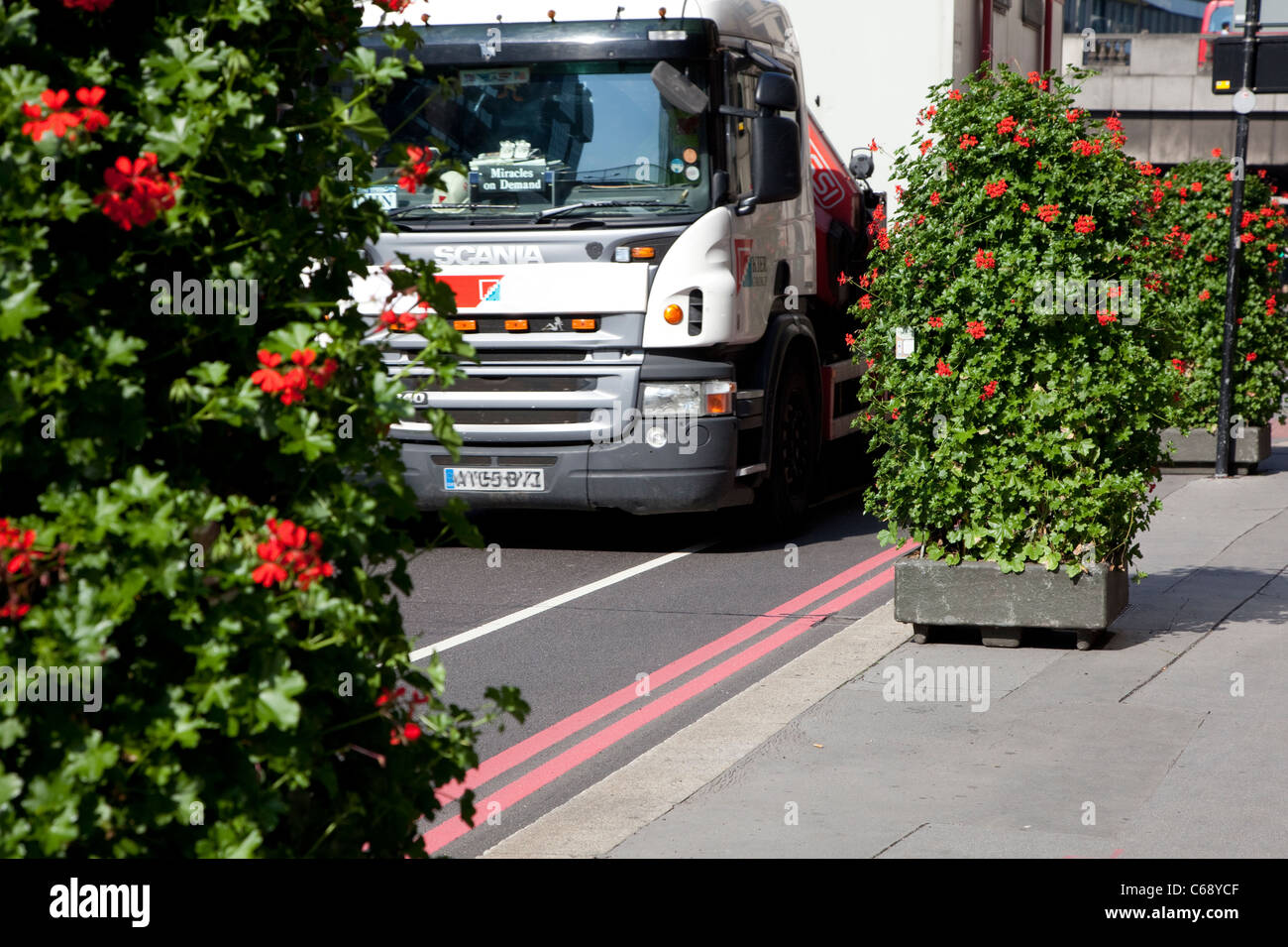 Plants placed in City of London street to absorb pollution from heavy traffic Stock Photo