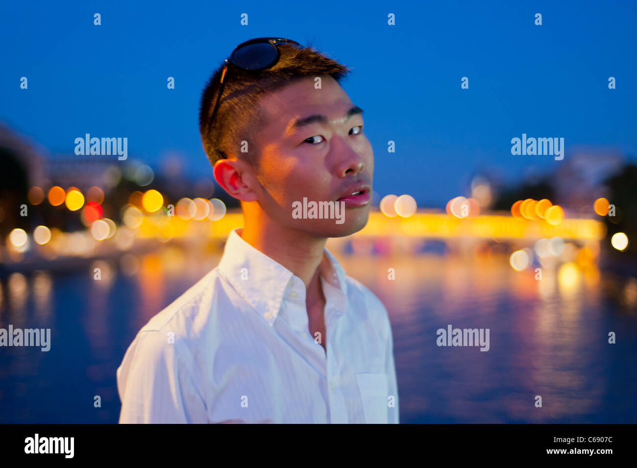 Portrait, Young Man, Chinese Outside at Night, Paris, France, man face Frontal Stock Photo