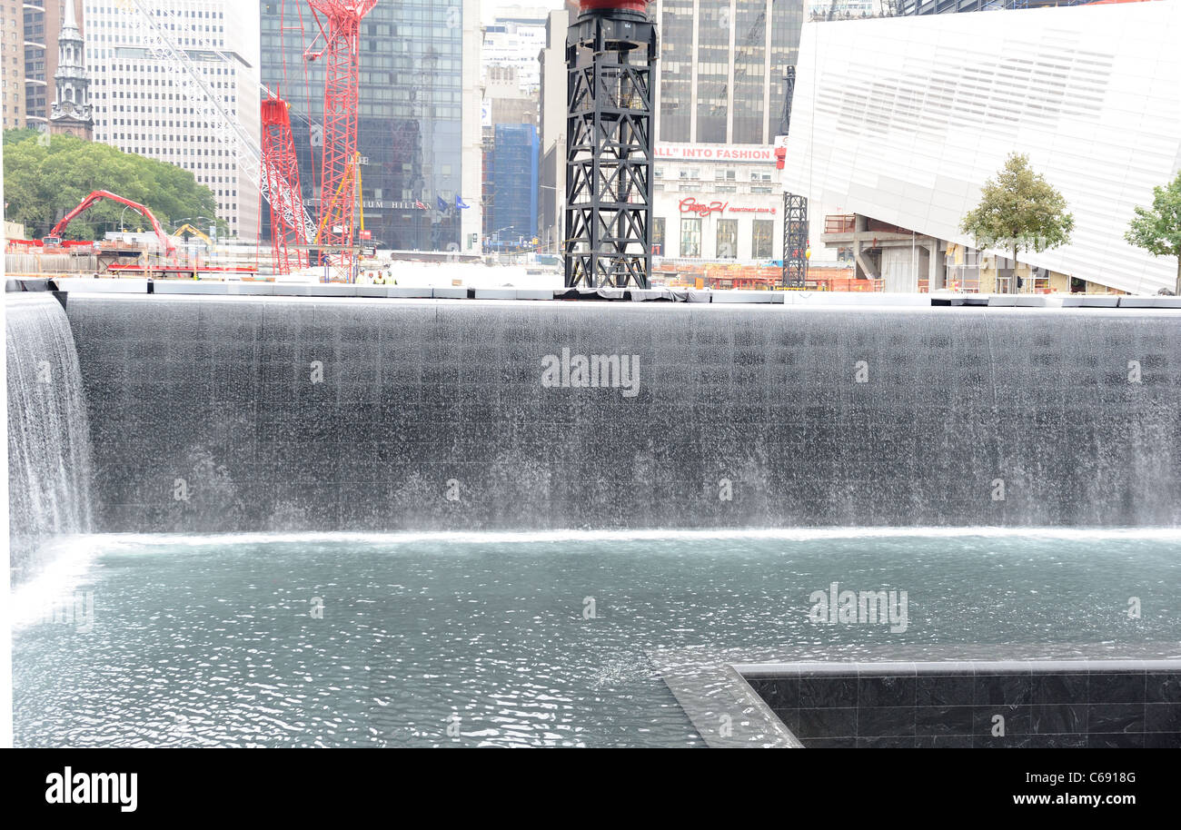 One of the two reflecting pools at the World Trade Center site with the National September 11 Museum in the background. Stock Photo