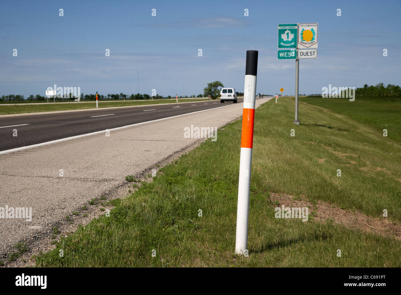 edge of road marker signposts for deep snow on trans canada highway 1 and yellowhead route in manitoba canada Stock Photo
