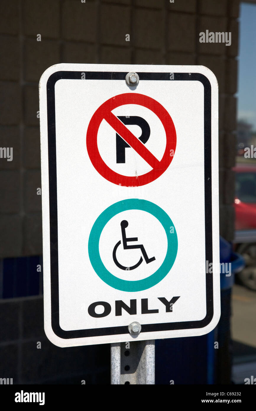 no parking restriction signs signposts disabled parking only Saskatoon Saskatchewan Canada Stock Photo