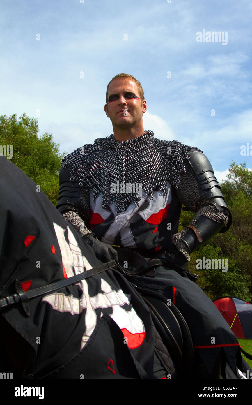 TV & film stuntman, JUSTIN PEARSON, performing with the spectacular Knights of the Damned jousting medieval display team, with galloping horses, stunts, falls, horsemanship, skilful mounted knights at Southport Flower Show, UK Stock Photo