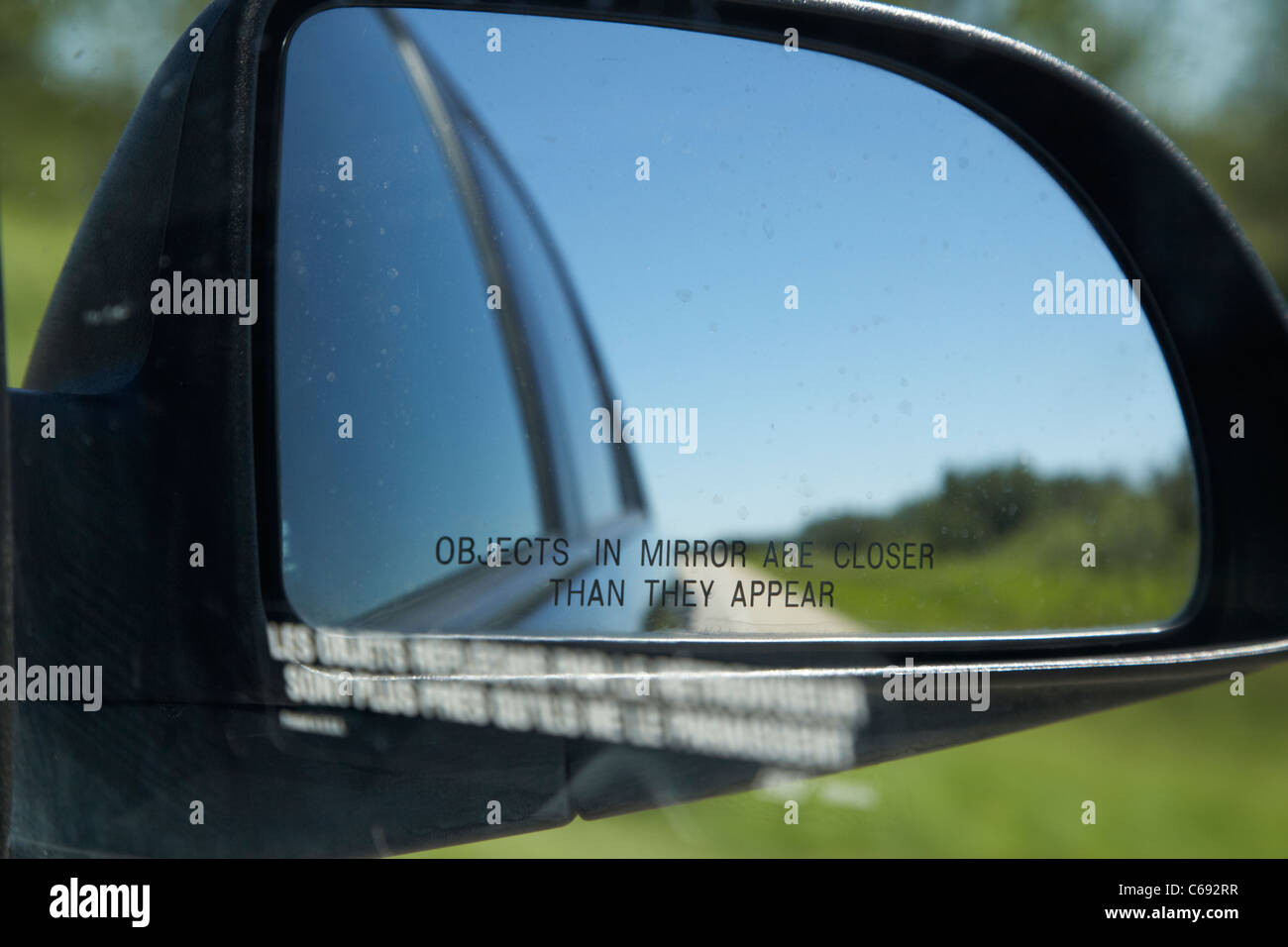 objects in mirror are closer than they appear in car side mirror on