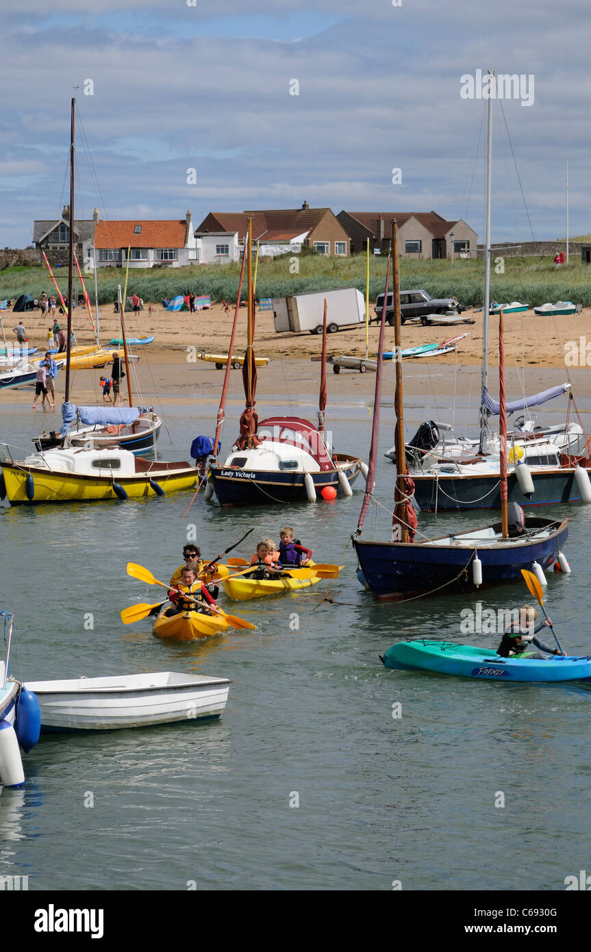 Children's holiday activities kayak race around the harbour at Elie a