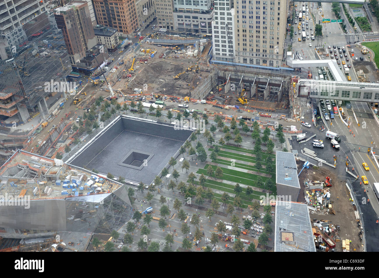 The World Trade Center construction site. The south Memorial Pool is in the foreground next to the National September 11 Museum. Stock Photo