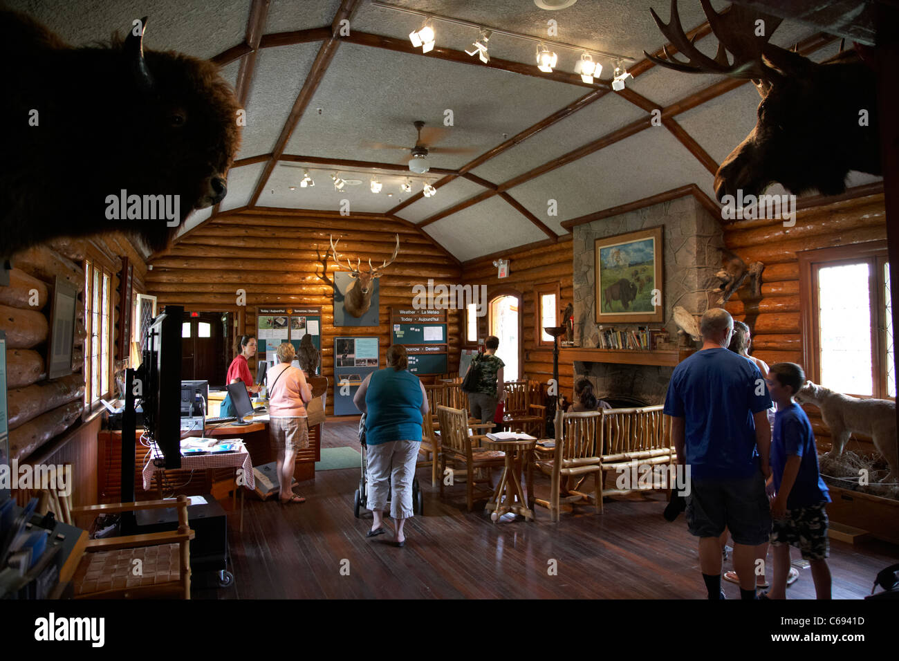 tourists inside riding mountain national park visitor centre wasagaming Manitoba Canada Stock Photo
