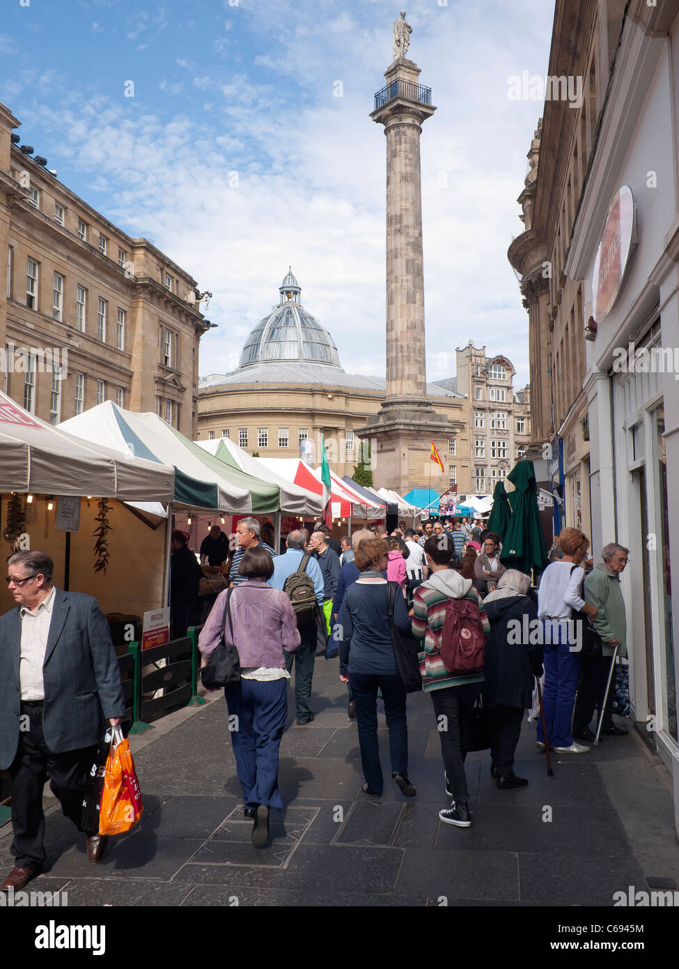 Dense crowd of people at a continental food market in Grainger Street Newcastle upon Tyne Stock Photo