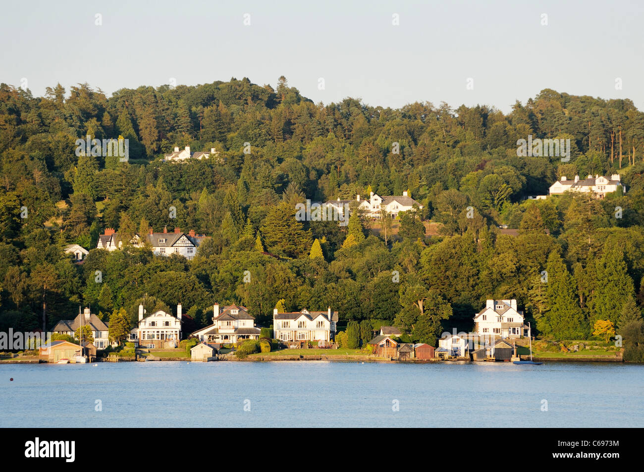 Windermere, Lake District National Park, Cumbria, England. Lake shore villas private houses near Ferry Nab on east shore. Summer Stock Photo