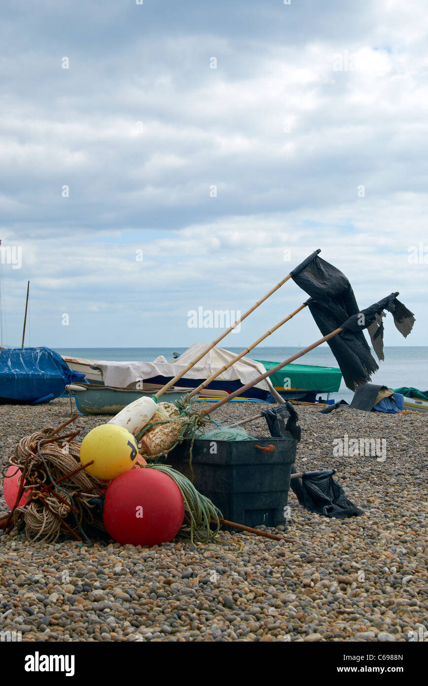 The beach at Beer, Devon, England with fishing boats, crab pots and