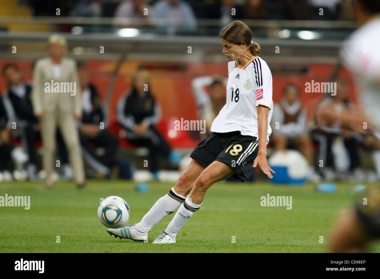 Kerstin Garefrekes of Germany kicks the ball during a FIFA Women's World Cup Group A match against Nigeria June 30, 2011. Stock Photo
