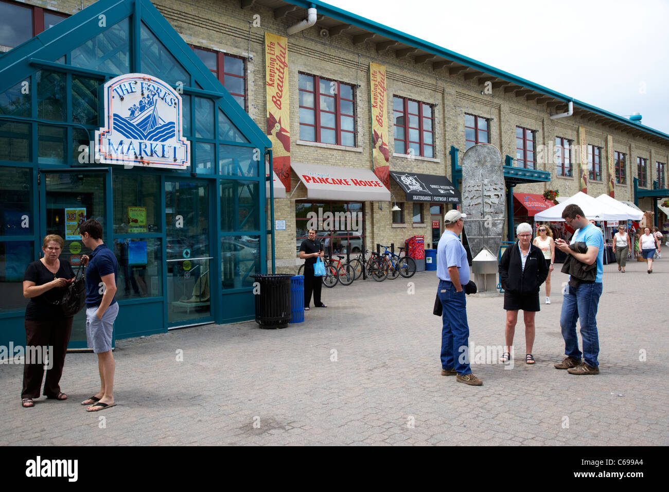 people outside the entrance to the forks market Winnipeg Manitoba Canada Stock Photo