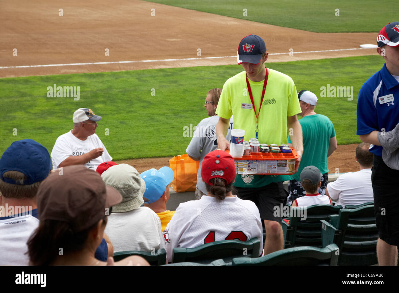 concessions staff selling beer and soft drinks at shaw park baseball stadium formerly canwest home to the winnipeg goldeyes Stock Photo