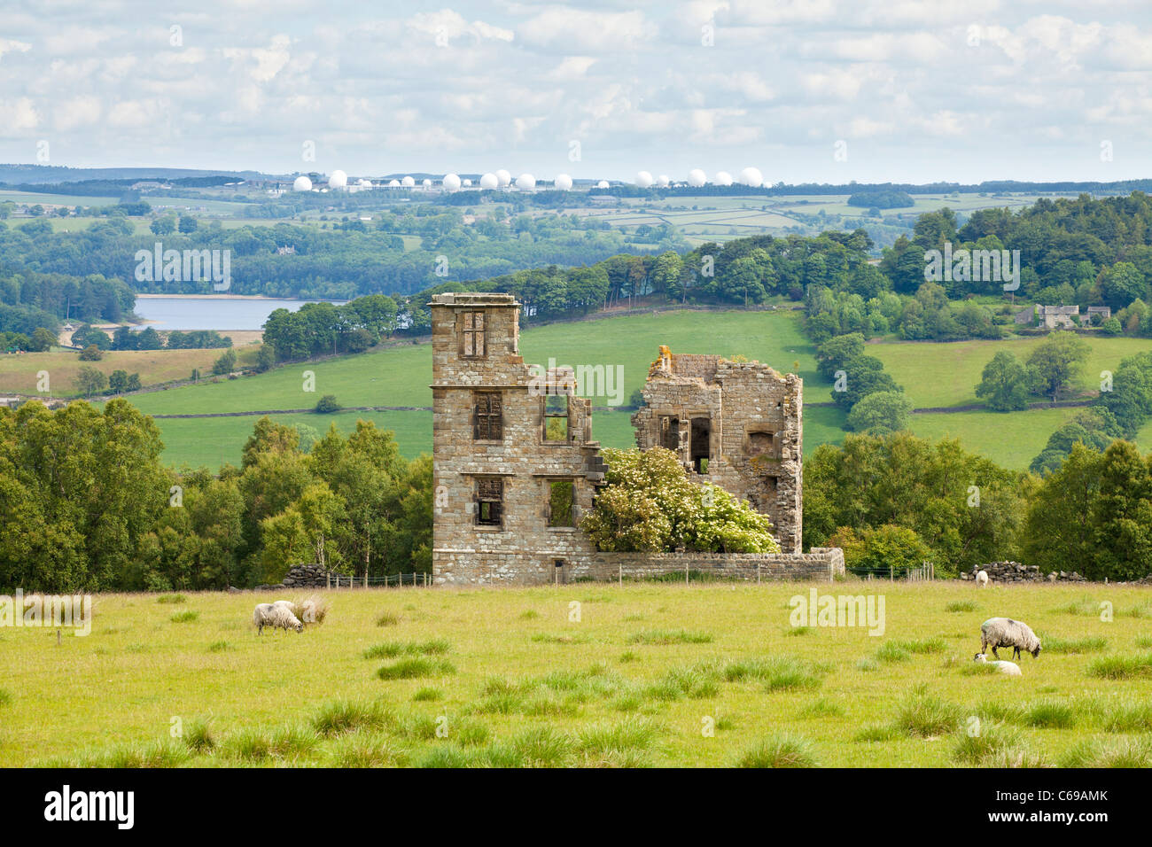 Dob Park Lodge now in ruins is an early 17th century lodge north of Otley, RAF Menwith Hill in the background, North Yorkshire. Stock Photo