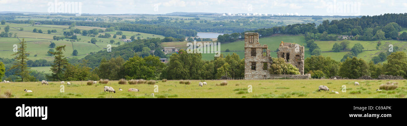 Dob Park Lodge now in ruins is an early 17th century lodge north of Otley, RAF Menwith Hill in the background, North Yorkshire. Stock Photo