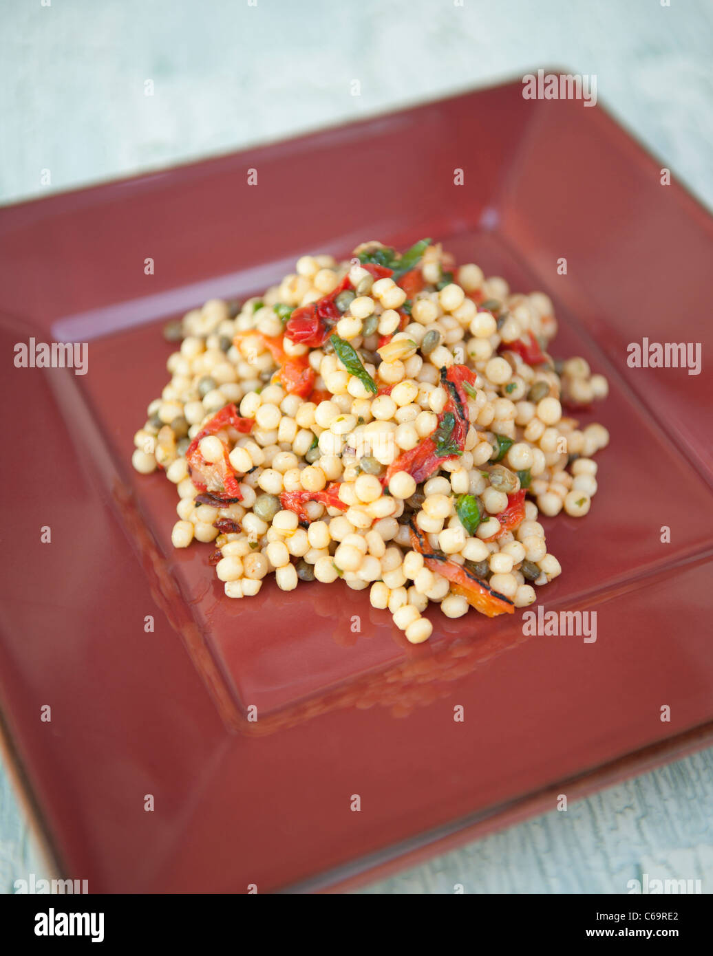 Giant Couscous on a plate Stock Photo Alamy