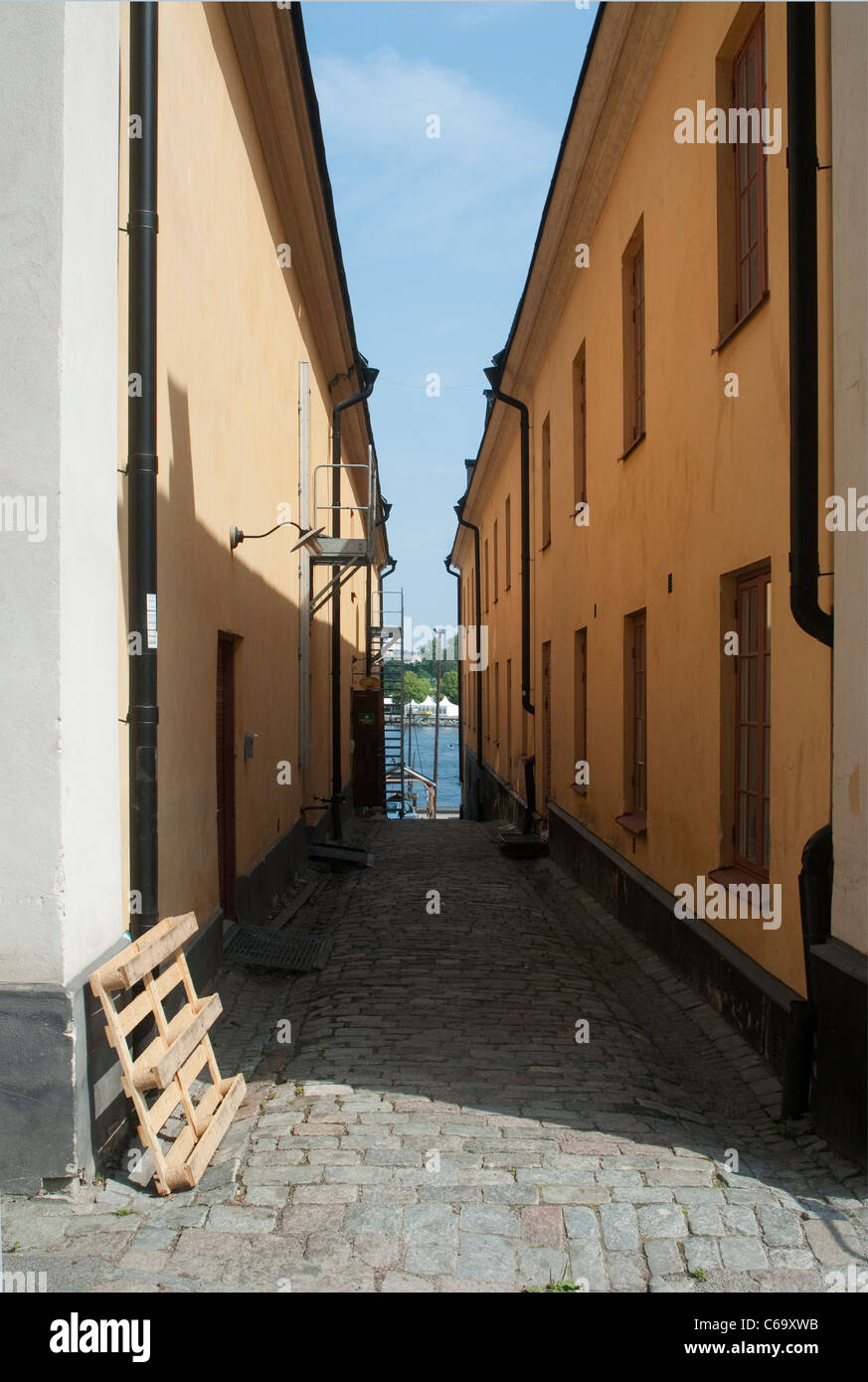 Passage between two harbour side buildings Skeppsholmen Island Stockholm Stock Photo