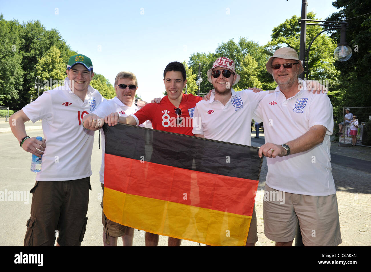 England fans arriving at the International FIFA Fan Fest at the Fanmeile on Strasse des 17. Juni street. Berlin, Germany - Stock Photo