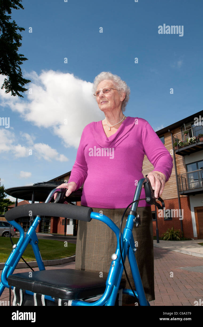 Elderly women uses walking aid Stock Photo - Alamy