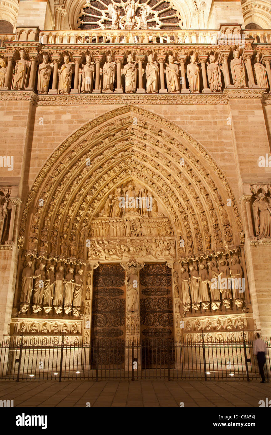 Paris - main portal of Notre-Dame cathedral at night Stock Photo