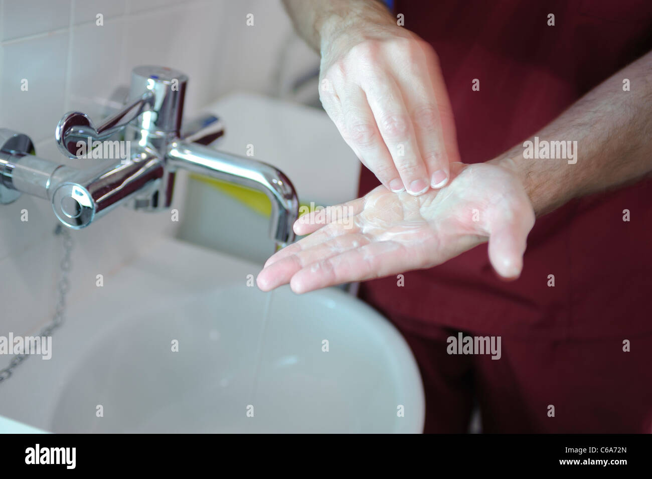 male nurse hands washing at sink Stock Photo