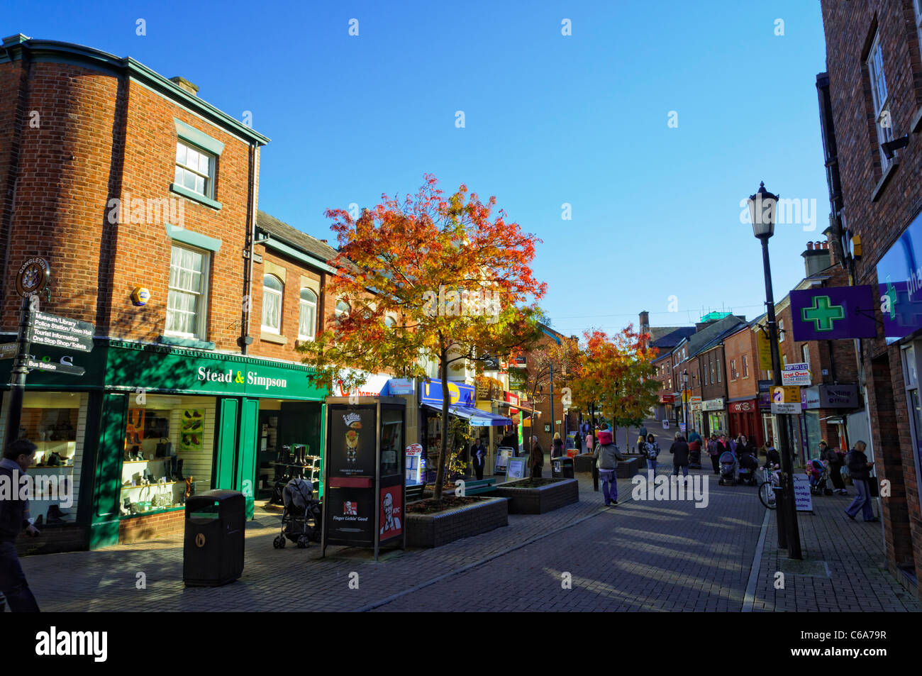 Pedestrianised main street of a typical small English town, with typical shops. Everyday life in small town UK. Stock Photo