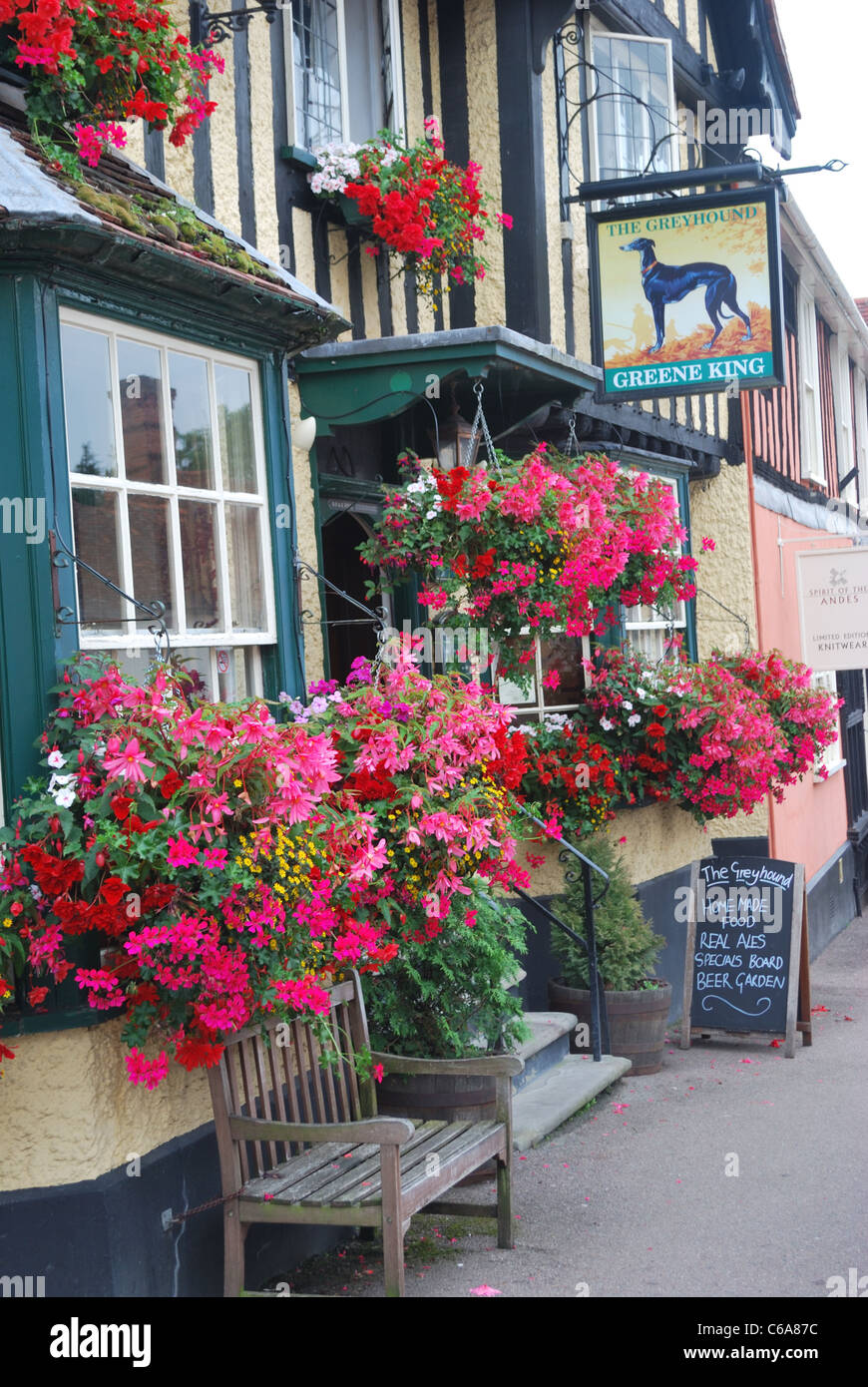 Greene king pub with flowers Stock Photo Alamy