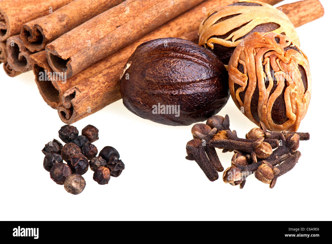nutmeg, cinnamon, cloves and pepper on white background Stock Photo Alamy