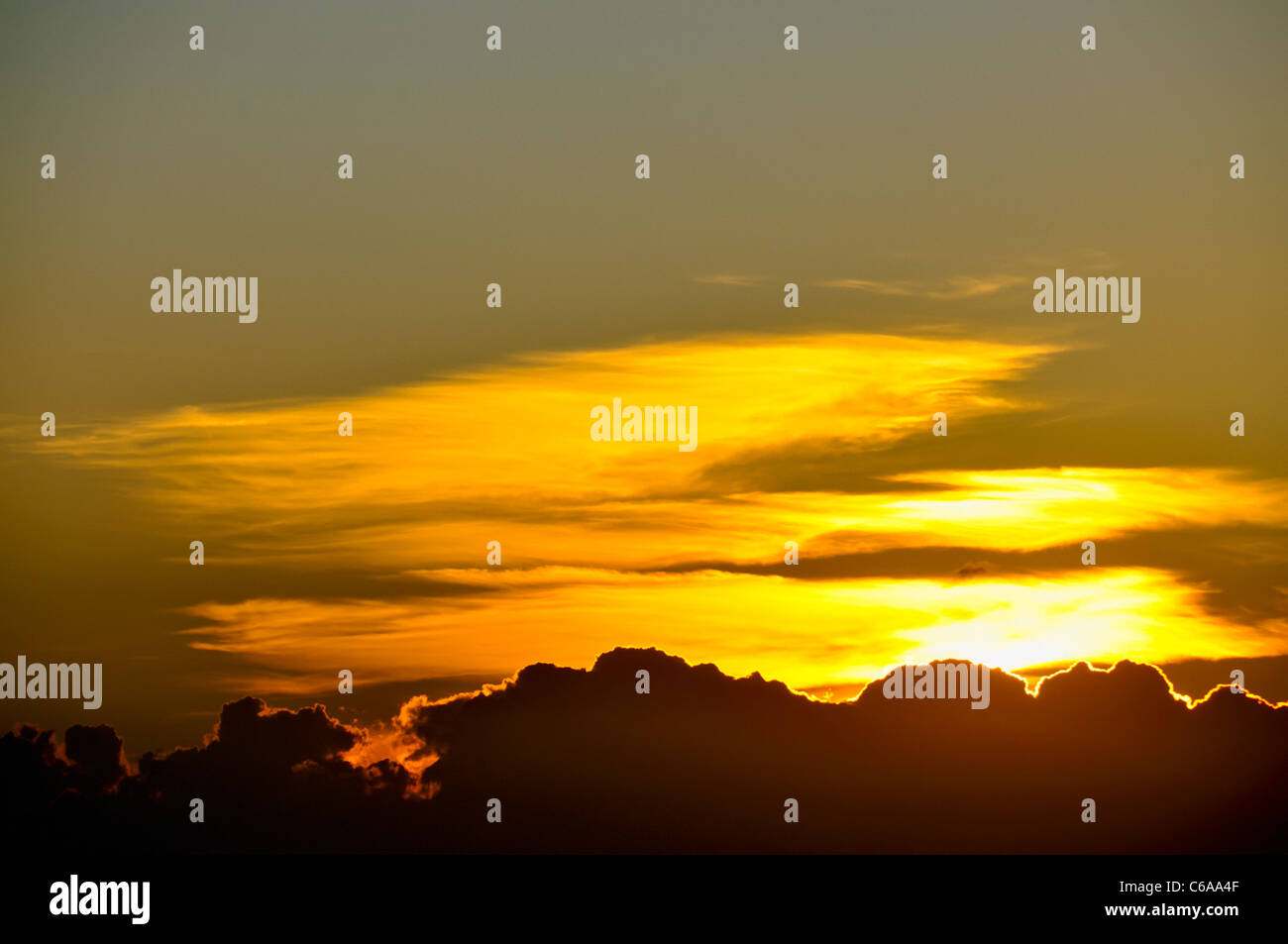 Sunrise. Ebro river at its base level, in front to the sea coast (Tortosa Cape). Ebro Delta